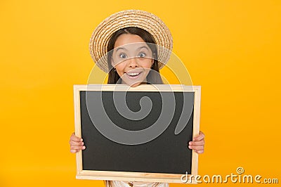 Small girl child wear summer style hat hold chalkboard information copy space, party invitation concept Stock Photo