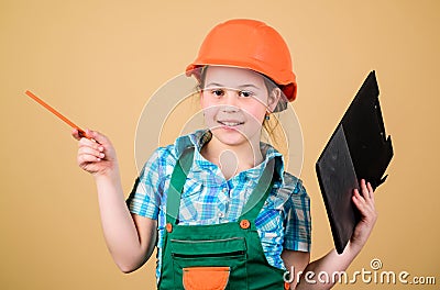 Small girl repairing in workshop. Foreman inspector. Repair. Safety expert. Future profession. Child care development Stock Photo