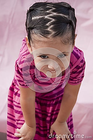 Small girl with teasing smile Stock Photo