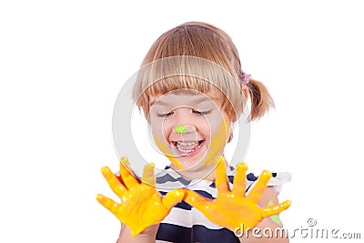 Small girl with yellow paint on her palms Stock Photo