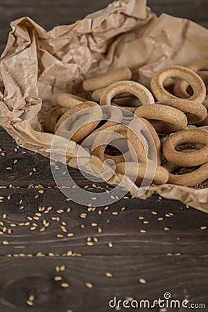 Small golden bagels in craft paper Stock Photo