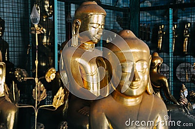 Small golden Buddha statues in Mandalay. Editorial Stock Photo