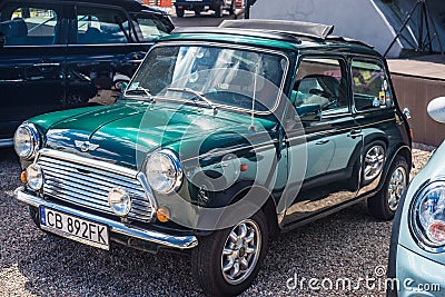 Small green Morris Mini Cooper parked Editorial Stock Photo