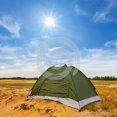 small green touristic tent among sandy prairie Stock Photo