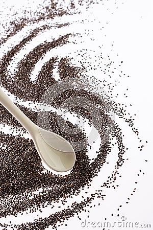 Small group of chia seeds isolated on white background. Closeup. Top view. Chia super food Stock Photo