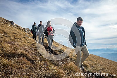 Group of friends hiking in the mountains Stock Photo