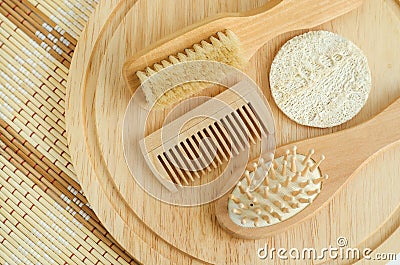 Small hair comb wooden hair brush and body massage brush. Eco friendly toiletries. Stock Photo