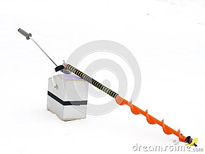 Small hand operated ice auger used in ice fishing Stock Photo