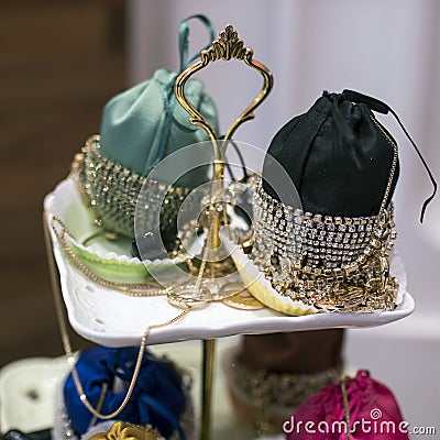 Small handbags bordered with silver jewelry for sale in store Stock Photo