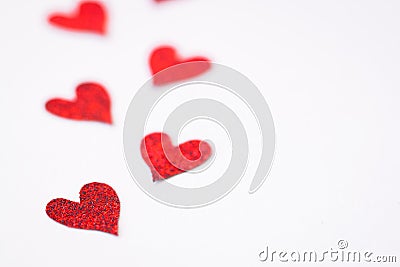 Small handmade red hearts. Isolated. Valentine`s or Wedding`s day postcard concept. Stock Photo
