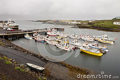 A small harbour in a city of Djupivogur, Iceland with a lot of small ships Editorial Stock Photo