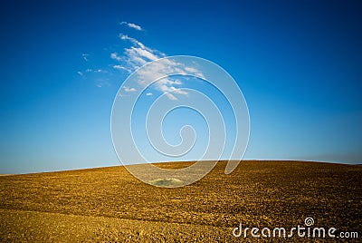 Small hill with blue sky Stock Photo