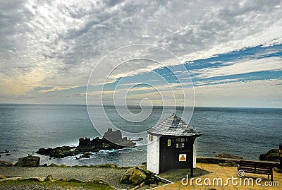 Small house on the edge of the cliff. Stock Photo