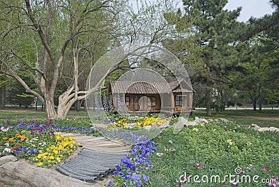 Small house on a lawn Stock Photo