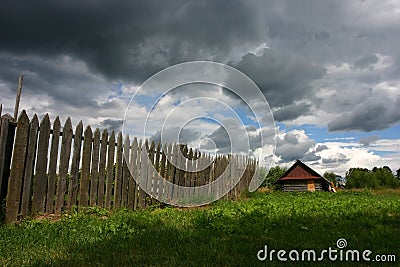 Small house and the storm sky Stock Photo