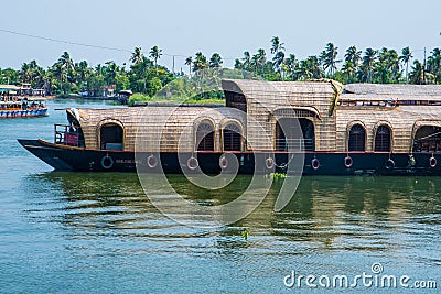 Traditional Houseboat seen sailing through the picturesque backwaters of Allapuzza or Alleppey in Kerala /India Editorial Stock Photo