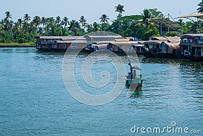 Traditional Houseboat seen sailing through the picturesque backwaters of Allapuzza or Alleppey in Kerala /India Editorial Stock Photo