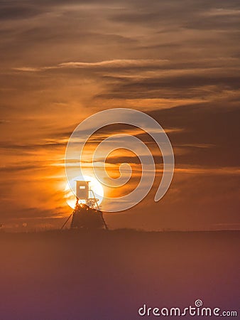 Hunting post in haze on sunset Stock Photo