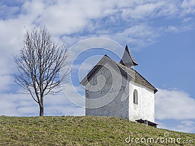 Small idyllic meadow chapel near Riegsee Stock Photo