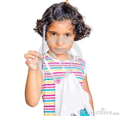 Small indian asian girl holding pencil Stock Photo