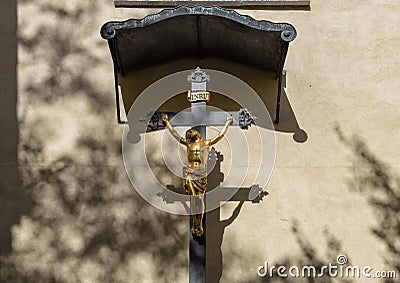 Small INRI with gold figure of Jesus being crucified, Prague, Czech Republic Stock Photo