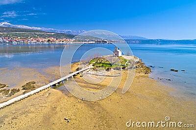 Small island church and coastal town of Posedarje aerial view Stock Photo