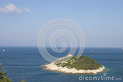 Small island in scenic ocean Stock Photo