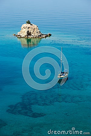 Small island solitary and sailing boat Stock Photo