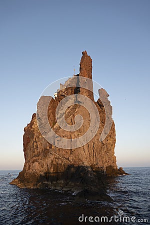 small island of strombolicchio a tiny volcanic island next to the volcanic island stromboli Stock Photo