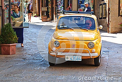 Small italian city car Fiat 500 on the street. Italy Editorial Stock Photo