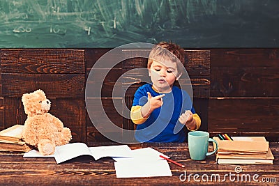 Small kid learning to count. Adding numbers with hands. Math lesson at kindergarten Stock Photo