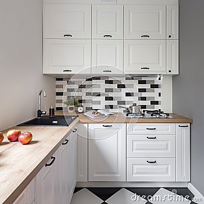 Small kitchen with white furniture Stock Photo