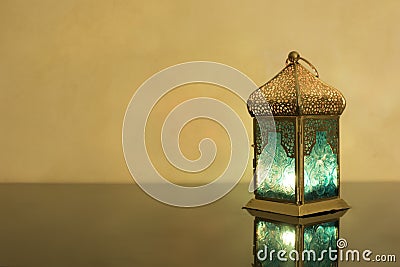 Small Lantern on a dark glass Stock Photo
