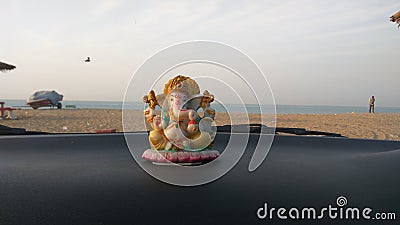 Lord Ganesha idol in car at mandvi beach, Gujarat Editorial Stock Photo