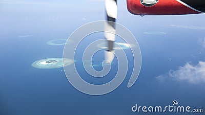Multiple small islands with coral reefs captured from the seaplane, Maldives Editorial Stock Photo