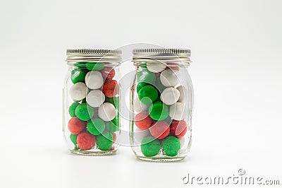 2 small mason jars filled with Christmas candy Stock Photo