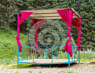 Small metal pavilion in the forest Stock Photo