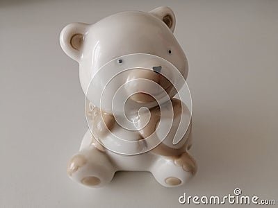 Small miniature ceramic bear with white background Stock Photo