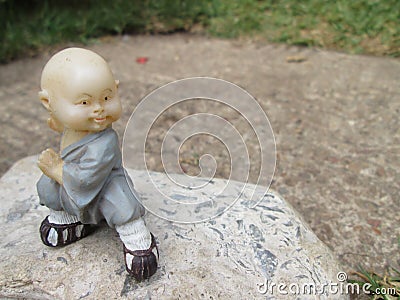 Small Monk Statue. Stock Photo
