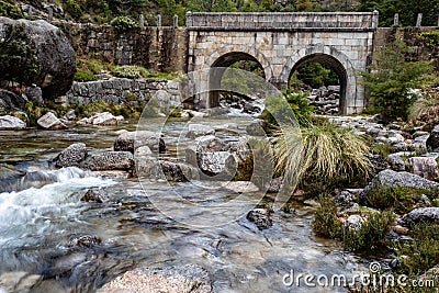 Small mountain bridge over a creek from the Peneda Geres National Park, north of Portugal Editorial Stock Photo