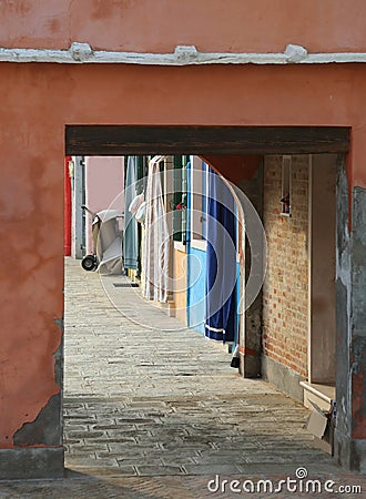 small narrow arcade passage in the italian Island Stock Photo