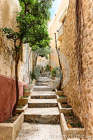 Small narrow rustic street inside the old village Dalt Vila in Ibiza town Stock Photo