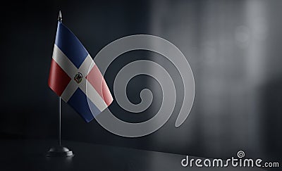 Small national flag of the Dominicana on a black background Stock Photo