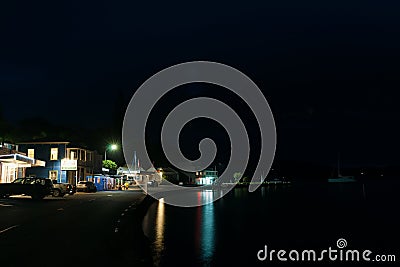 Small New Zealand coastal town main street at dusk, Mangonui Editorial Stock Photo