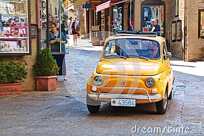 Small old italian city car Fiat 500 on the street Editorial Stock Photo