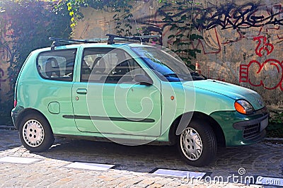 Small and old light green veteran Polish car Fiat Seicento private car parked Editorial Stock Photo