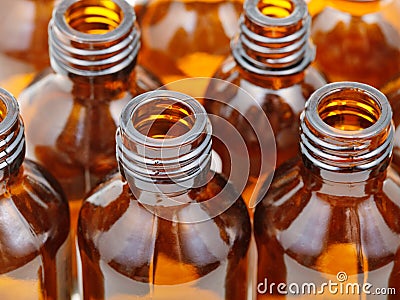 Small open brown glass pharmacy bottles close up Stock Photo