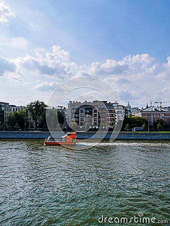 Small orange boat on the river Editorial Stock Photo