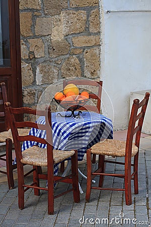 A small outdoor cafe and a bowl of fruit on the table Stock Photo