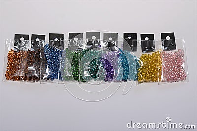 Small packs of colorful shiny silver lined glass beads Stock Photo